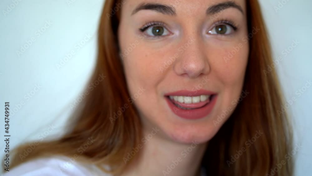 Crop attractive woman talking to camera