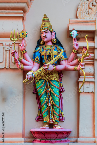 Colourful statues of Hindu religious deities adorning the interior of a Hindu temple in Singapore.