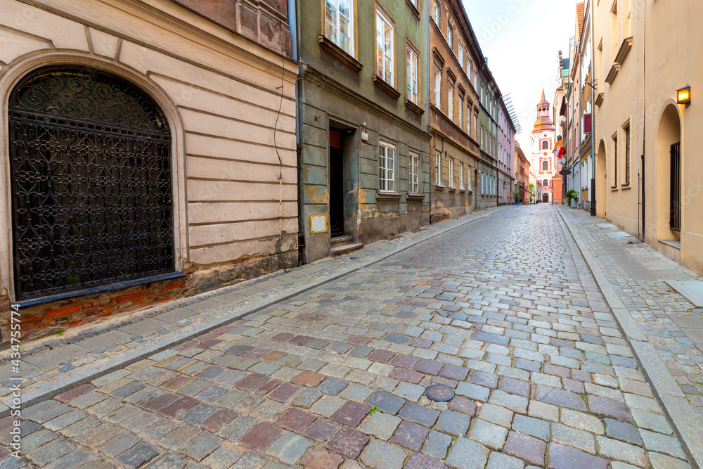 Poznan. Old traditional narrow city street at sunrise. Poznan. Old traditional narrow city street at sunrise.