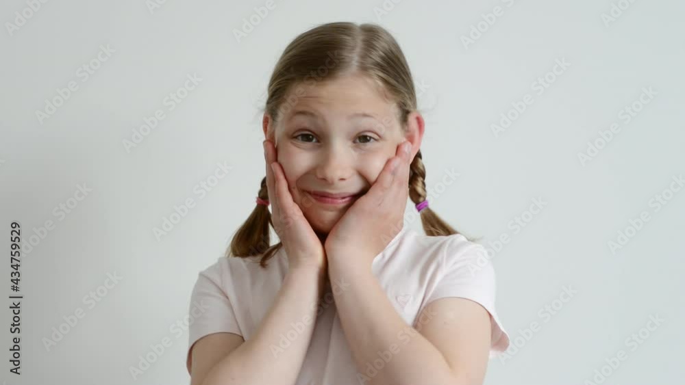 Cute teen girl posing with tender emotion on white background Cute teen girl posing with tender emotion on white background