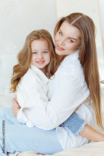 portrait of mom and daughter in the studio
