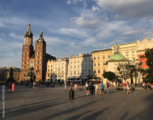 The  St. Mary's Basilica, the Church of St. Adalbert and the Adam Mickiewicz Monument in Kraków's Main Square.