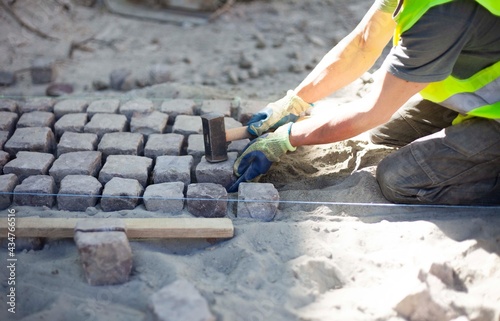 Road repairs, installation of a new sidewalk made of ancient cobblestones