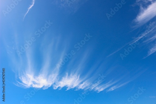 High white cirrus clouds against a deep blue sky © Tony ALS