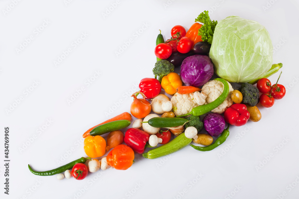 Many various vegetables on white Many various vegetables on white