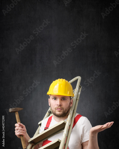 Portrait of a clumsy worker with tools