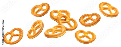 Falling salted pretzels isolated on white background