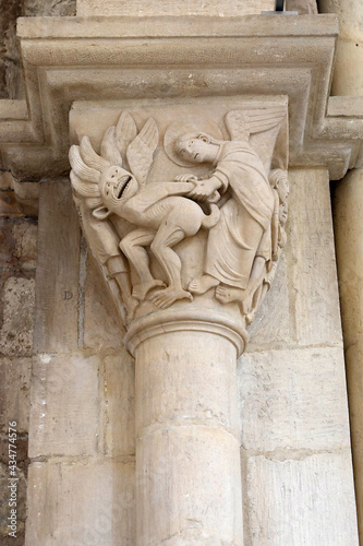 Saint Mary Magdalene basilica, Vezelay, France. Capital depicting Angel Raphael vanquishing Asmodeus photo