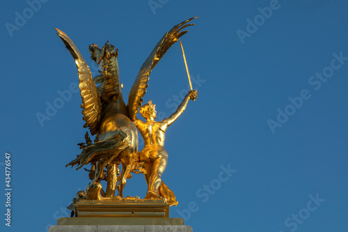 Statue on Alexander III bridge, Paris, France.