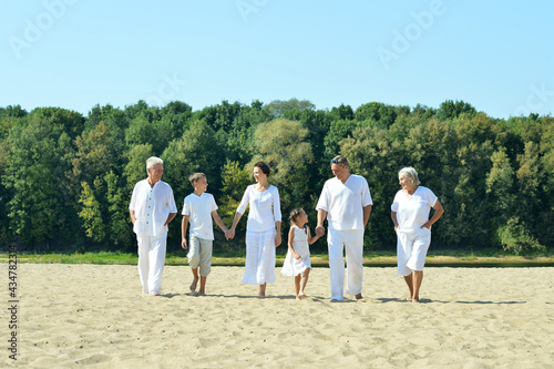 Happy family together on sand beach