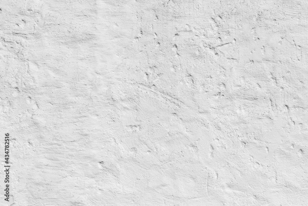 old plaster wall painted in white gives a harmonic background