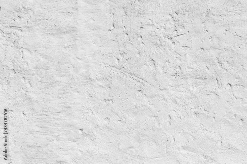 old plaster wall painted in white gives a harmonic background