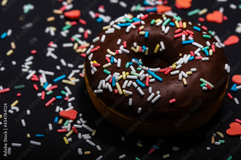 chocolate donuts with sugar sprinkles