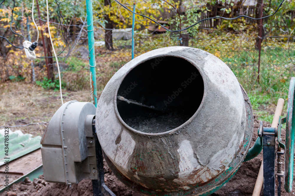 Mixing of concrete in the concrete mixer at construction site