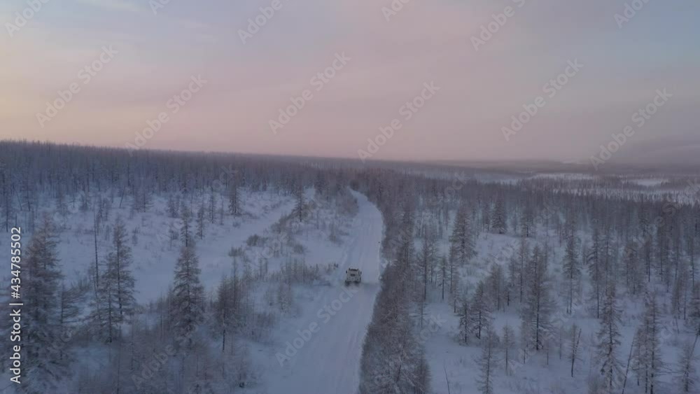 The six-wheel Trekol all-terrain vehicle rides through the snow-covered tundra in the sunset light
The six-wheel Trekol all-terrain vehicle rides through the snow-covered tundra in the sunset light