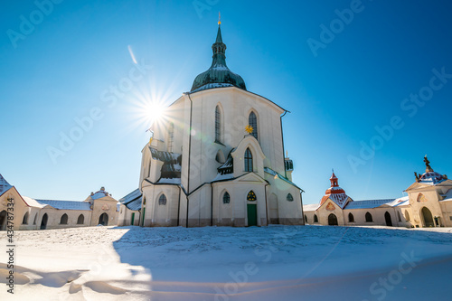 The Pilgrim Church of St. John of Nepomuk on Zelena Hora - Green Mountain, Zdar nad Sazavou, Czech Republic, UNESCO heritage. Winter weather with snow. Sunny frozen day.