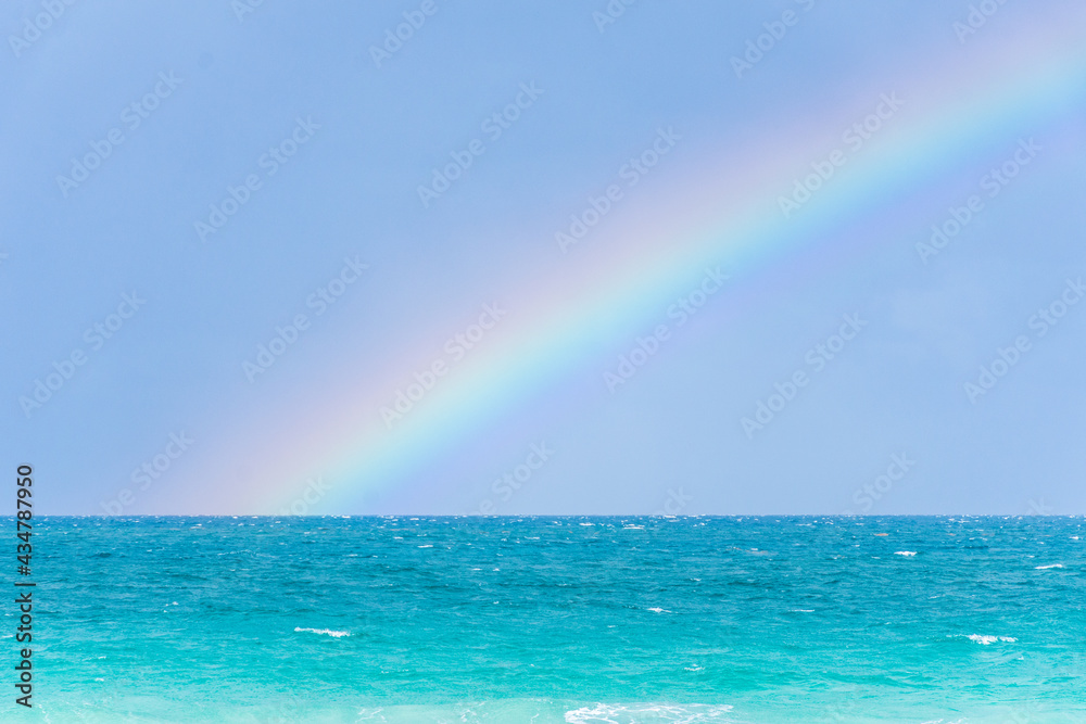 Rainbow on a cloudy day at the beach Rainbow on a cloudy day at the beach