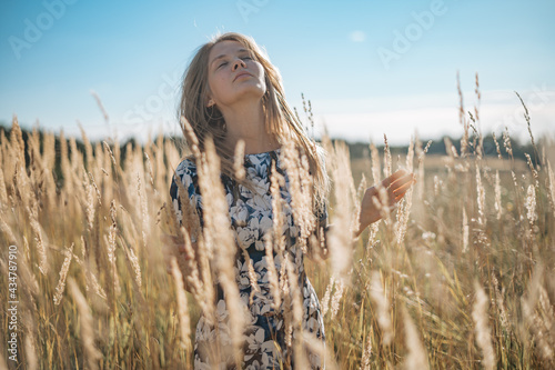 Beauty Romantic Girl Outdoors. Beautiful Teenage Model girl Dressed in Casual Dress on the Field in Sun Light. Glow Sun, Sunshine © grthirteen