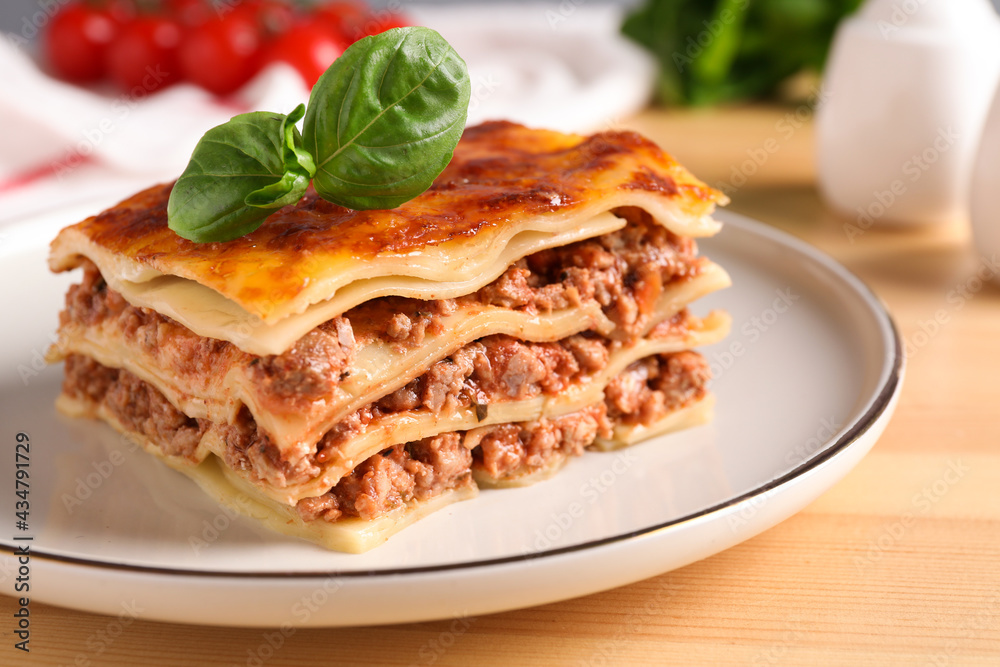 Delicious cooked lasagna served on wooden table
