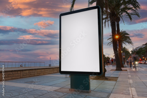 Blank billboard next to the beach