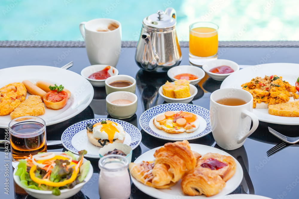American Breakfast Set with Teapot on Table Next to Poolside in Resort. English Morning Food Near Swimming Pool in Luxury Hotel. Summer Holidays in Tropical Country, Thailand. Travel and Relax