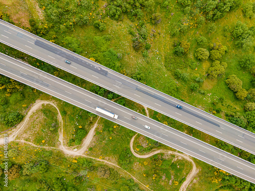 Autopista colgante con vistas desde el cielo con un drone de Bejar, en la provincia de Salamanca durante un día soleado photo