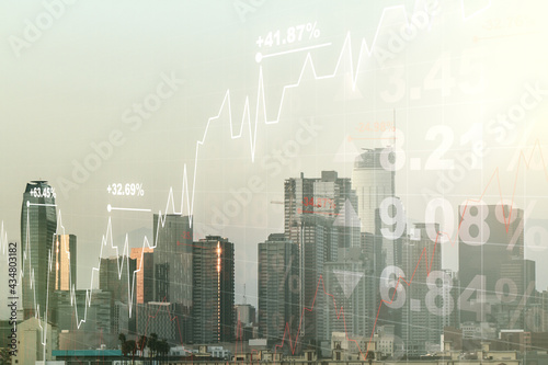 Abstract virtual financial graph hologram on Los Angeles cityscape background, financial and trading concept. Multiexposure