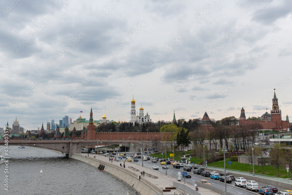 Panorama of center of Moscow: view on Kremlin, Moscow City skyscrapers, Moscow river and embankment. Famous touristic view.