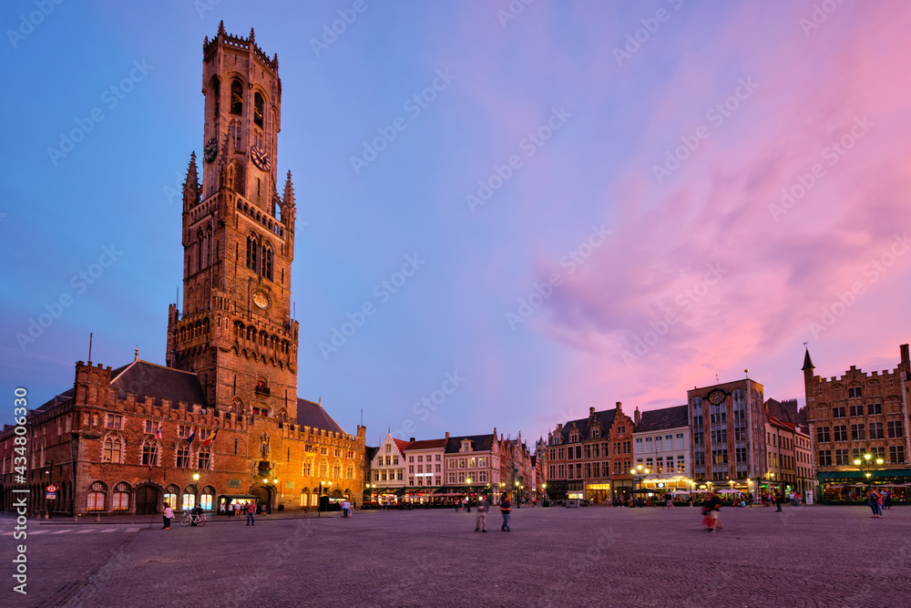 Obraz premium Belfry tower and Grote markt square in Bruges, Belgium on dusk in twilight