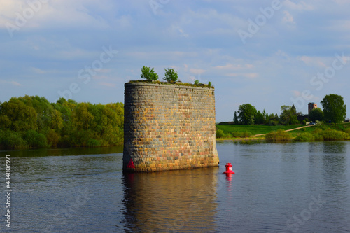 The pillars of the ancient unfinished bridge view from the river Volkhov