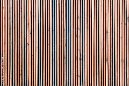 Wooden vertical boards. The surface is made of fine lines. Texture for background