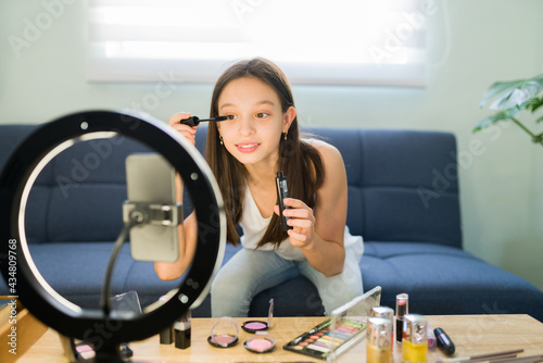 Fototapeta Naklejka Na Ścianę i Meble -  Reviewing makeup products for a video