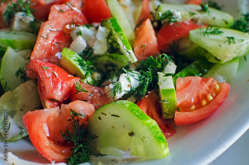 Healthy Salad with Cucumber, Tomatoes and dill. Close up.