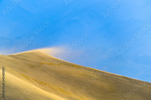 Blowing sand on sand dune