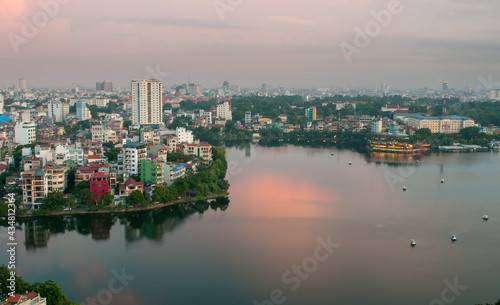 Cityscape of Hanoi and lake Hoan kiem in Vietnam Asia late in the evening