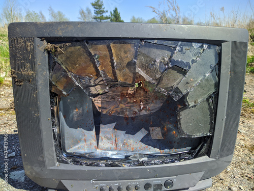 broken screen of old tube tv outdoors close up photo photo