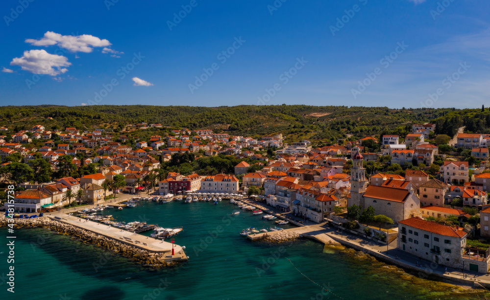 Town of Sutivan skyline view, Island of Brac, Croatia. Aerial drone view in august 2020