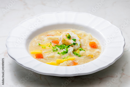 cauliflower soup with carrot, potatoes and poache egg