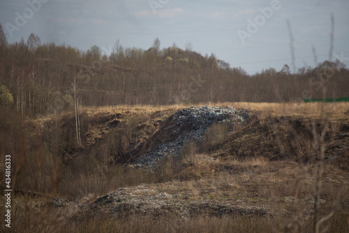 flocks of birds at the landfill. the landfill of dirty household waste pollutes the environment. the environmental problem of garbage dumps photo