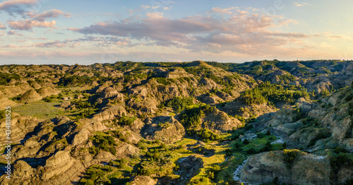 Setting sun at the Makoshika State Park in Montana - Badlands photo