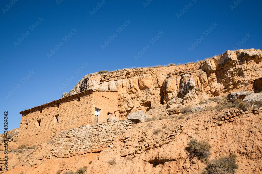 an old house made of clay on a hill in the suburb of Ariza (Community of Calatayud), province of Zaragoza, Aragon, Spain