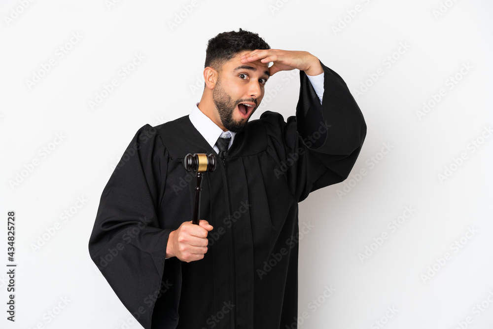 Judge arab man isolated on white background doing surprise gesture while looking to the side Judge arab man isolated on white background doing surprise gesture while looking to the side