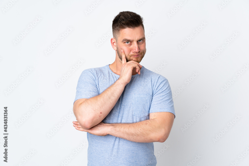 Russian handsome man over isolated background and thinking Russian handsome man over isolated background and thinking