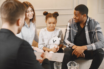 Family with daughter having a test at psyhoterapist