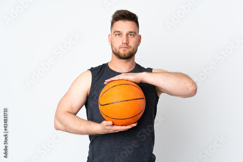 Russian handsome man isolated on white background playing basketball