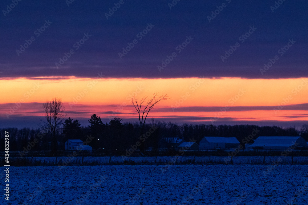 Colorful sunrise in the countryside in winter