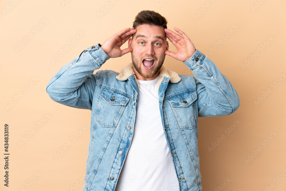 Russian handsome man over isolated background with surprise expression Russian handsome man over isolated background with surprise expression