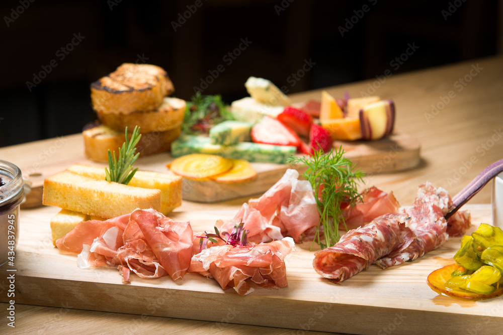 A Charcuterie, or cold cut, platter, at a Whistler restaurant.  Meat, ham, port, salami, pate, cheese, and fruit.