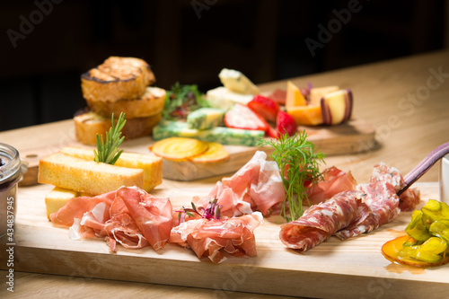 A Charcuterie, or cold cut, platter, at a Whistler restaurant. Meat, ham, port, salami, pate, cheese, and fruit.