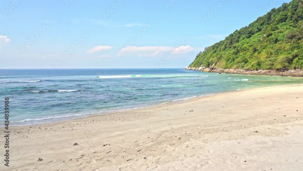 Blue ocean waves break on tropical empty beach. Static view Blue ocean waves break on tropical empty beach. Static view